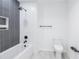Modern bathroom with stylish gray and white tiling, sleek fixtures, and a shower/tub combination at 777 3Rd N Ave # 707, St Petersburg, FL 33701