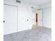 Bedroom with modern closet and tile flooring at 777 3Rd N Ave # 707, St Petersburg, FL 33701