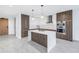 Open concept kitchen with island, stainless steel appliances, and a view to the dining area at 777 3Rd N Ave # 707, St Petersburg, FL 33701