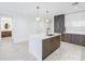 Modern kitchen featuring a sleek island, stylish cabinetry, and stainless steel appliances at 777 3Rd N Ave # 707, St Petersburg, FL 33701