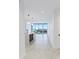 Bright living room and kitchen area with city views through sliding glass doors and modern pendant lighting at 777 3Rd N Ave # 707, St Petersburg, FL 33701
