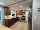 Well-appointed kitchen with stainless steel appliances, wood countertops, and abundant cabinet space at 8718 Arrowhead Dr, Hudson, FL 34667