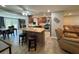Open-concept kitchen featuring a central island with seating, stainless appliances, and wood cabinets at 8718 Arrowhead Dr, Hudson, FL 34667