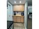 Functional kitchen area with ample cabinet space and modern appliances, complemented by a coffee bar at 8718 Arrowhead Dr, Hudson, FL 34667