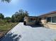 Spacious backyard patio area with room for seating and grilling, ideal for outdoor entertainment and relaxation at 8718 Arrowhead Dr, Hudson, FL 34667