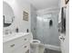 Well-maintained bathroom with marble tile, glass shower, and modern vanity at 111 Inwood Cir, Brandon, FL 33510