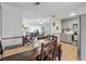 Cozy dining area featuring wood table and seating, open to living area and kitchen at 111 Inwood Cir, Brandon, FL 33510
