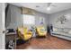 Cozy living room with wood floors, bright seating, and modern decor at 111 Inwood Cir, Brandon, FL 33510