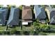 Aerial view of residences featuring well-kept lawns, fenced yards, and landscaped backyards at 11656 Lake Blvd, New Port Richey, FL 34655