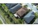 Aerial view of a home with a well-maintained lawn and white-fenced backyard at 11656 Lake Blvd, New Port Richey, FL 34655