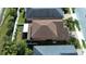 Aerial view featuring the roof and backyard of a well-maintained home and landscaping at 11656 Lake Blvd, New Port Richey, FL 34655