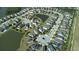 Stunning aerial view of a residential community with ponds and well-maintained lawns, showcasing a desirable neighborhood at 11656 Lake Blvd, New Port Richey, FL 34655