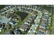 Aerial view of a neighborhood with a pond and lush greenery, highlighting Gathering-friendly living at 11656 Lake Blvd, New Port Richey, FL 34655