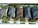 Aerial view of residences showing brick driveways and meticulous lawns in a Gathering-friendly community at 11656 Lake Blvd, New Port Richey, FL 34655
