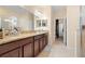 Bathroom features dual sink vanity with granite countertop and walk-in shower at 11656 Lake Blvd, New Port Richey, FL 34655