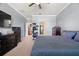 Bedroom features neutral walls, modern furniture, and an adjacent bonus room at 11656 Lake Blvd, New Port Richey, FL 34655