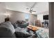 Bonus room with cozy seating, desk, television, and a ceiling fan at 11656 Lake Blvd, New Port Richey, FL 34655