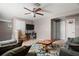 Bonus room features a comfortable seating area and a desk with computer at 11656 Lake Blvd, New Port Richey, FL 34655