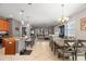 Inviting open concept showcasing the kitchen, dining, and living areas, ideal for modern living at 11656 Lake Blvd, New Port Richey, FL 34655