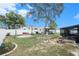 Expansive backyard showcasing a cozy fire pit, swing and outdoor living space, ideal for entertaining and relaxing at 13416 Algoma Ave, Spring Hill, FL 34609