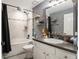 Modern bathroom with a tub-shower, stylish vanity, and contemporary fixtures for a spa-like experience at 13416 Algoma Ave, Spring Hill, FL 34609