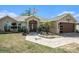 Charming single-story home featuring an inviting entrance, well-maintained landscaping, and an attached two-car garage at 13416 Algoma Ave, Spring Hill, FL 34609