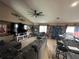 Spacious living room features a large sectional sofa, ceiling fan, and stylish decor, great for Gathering gatherings at 13416 Algoma Ave, Spring Hill, FL 34609