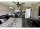 Spacious main bedroom with modern decor, ceiling fan, and en-suite bathroom, a relaxing retreat at 13416 Algoma Ave, Spring Hill, FL 34609