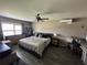 Comfortable main bedroom features a ceiling fan, dresser, and closet for ample storage at 13416 Algoma Ave, Spring Hill, FL 34609