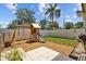 Fenced backyard featuring a playset with slide and swings creating a fun outdoor oasis at 1414 Sunset Ln, Lutz, FL 33549