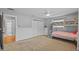 Spacious bedroom with bunk beds, closet and neutral carpet flooring at 1414 Sunset Ln, Lutz, FL 33549