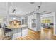 Spacious kitchen with island, modern appliances and dining area at 1414 Sunset Ln, Lutz, FL 33549