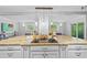 Spacious kitchen island with cooktop and countertop space, complemented by stylish pendant lighting at 1414 Sunset Ln, Lutz, FL 33549