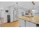 Well-equipped kitchen with stainless steel appliances and a large island, showcasing an open layout at 1414 Sunset Ln, Lutz, FL 33549