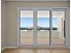 Sliding glass doors that give way to a balcony with views of the city and the ocean at 1460 Gulf Blvd # 1206, Clearwater Beach, FL 33767