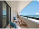 This cozy balcony features stunning ocean views, comfortable seating, and a peaceful atmosphere at 1460 Gulf Blvd # 1206, Clearwater Beach, FL 33767