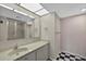 Bathroom featuring a sink with a mirror and an enclosed shower at 1460 Gulf Blvd # 1206, Clearwater Beach, FL 33767