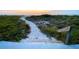 Sandy path and steps lead to the beach and the ocean at 1460 Gulf Blvd # 1206, Clearwater Beach, FL 33767