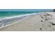 Waves crash on the shore of a white sand beach at 1460 Gulf Blvd # 1206, Clearwater Beach, FL 33767