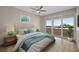 This bright main bedroom boasts balcony access, a plush king bed, and calming coastal views at 1460 Gulf Blvd # 1206, Clearwater Beach, FL 33767