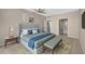 This main bedroom features a walk-in closet, a plush king bed, and soft neutral tones at 1460 Gulf Blvd # 1206, Clearwater Beach, FL 33767