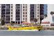 Bright yellow boat with people on a waterway, set against a condo backdrop at 1460 Gulf Blvd # 1206, Clearwater Beach, FL 33767
