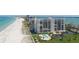 High-rise beachfront condo building features lush landscaping and sparkling swimming pool at 1460 Gulf Blvd # 1206, Clearwater Beach, FL 33767