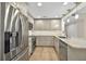 Modern kitchen featuring stainless steel appliances, granite countertops, and stylish pendant lighting at 1460 Gulf Blvd # 1206, Clearwater Beach, FL 33767