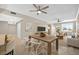 Open-concept living room features a dining area, comfortable seating, and a large window with great natural light at 1460 Gulf Blvd # 1206, Clearwater Beach, FL 33767