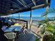 Outdoor dining area offers stunning water views with comfortable seating at 1460 Gulf Blvd # 1206, Clearwater Beach, FL 33767