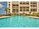 Relaxing community pool, with lots of room for lounge chairs, sits in front of the condo building at 1460 Gulf Blvd # 1206, Clearwater Beach, FL 33767