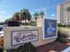 Columbia Restaurant sign with lush landscaping in front of a condo building at 1460 Gulf Blvd # 1206, Clearwater Beach, FL 33767