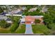 Aerial view of a home with a red roof and mature landscaping at 1469 S Hillcrest Ave, Clearwater, FL 33756