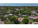 Aerial view showcasing the lush greenery, mature trees, and serene neighborhood surrounding the property at 1469 S Hillcrest Ave, Clearwater, FL 33756